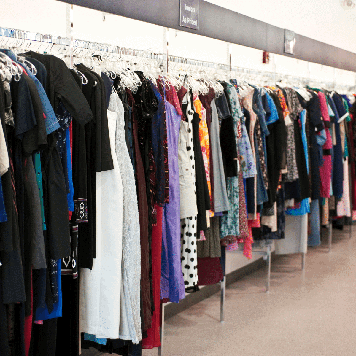 thrift store dresses hanging on racks